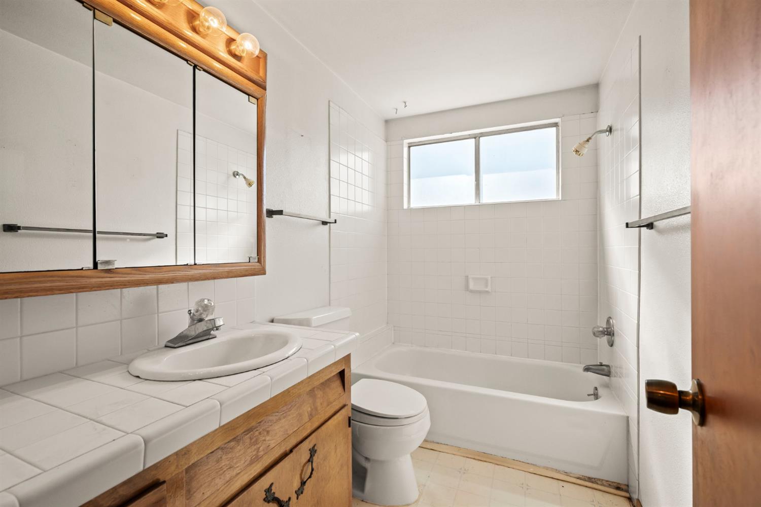 2860 Jim Valley Road Placerville, CA 95667 - Photo 23 of 34 a bathroom with a sink toilet a vanity and shower
