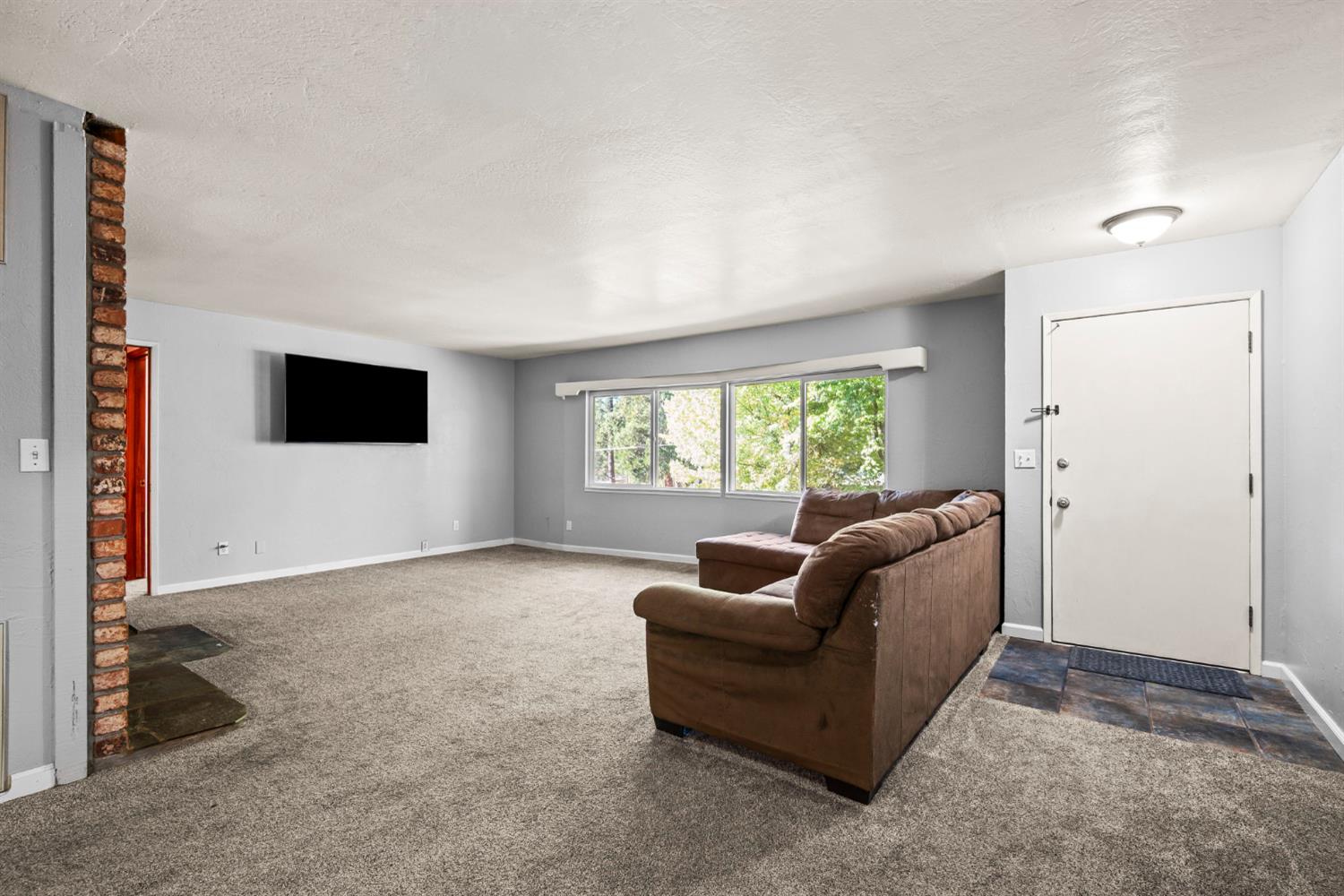 2860 Jim Valley Road Placerville, CA 95667 - Photo 6 of 34 a living room with furniture and a flat screen tv