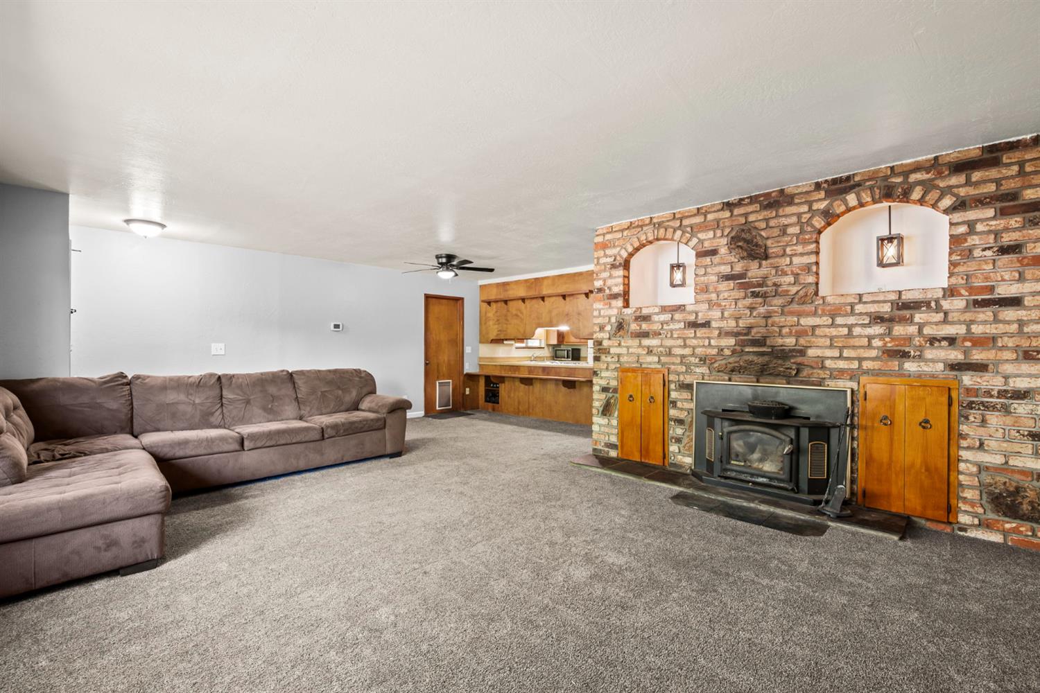 2860 Jim Valley Road Placerville, CA 95667 - Photo 9 of 34 a living room with furniture and a fireplace