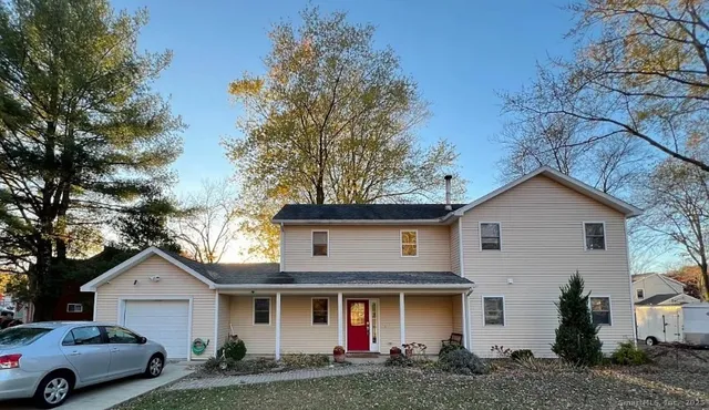 a front view of a house with garage