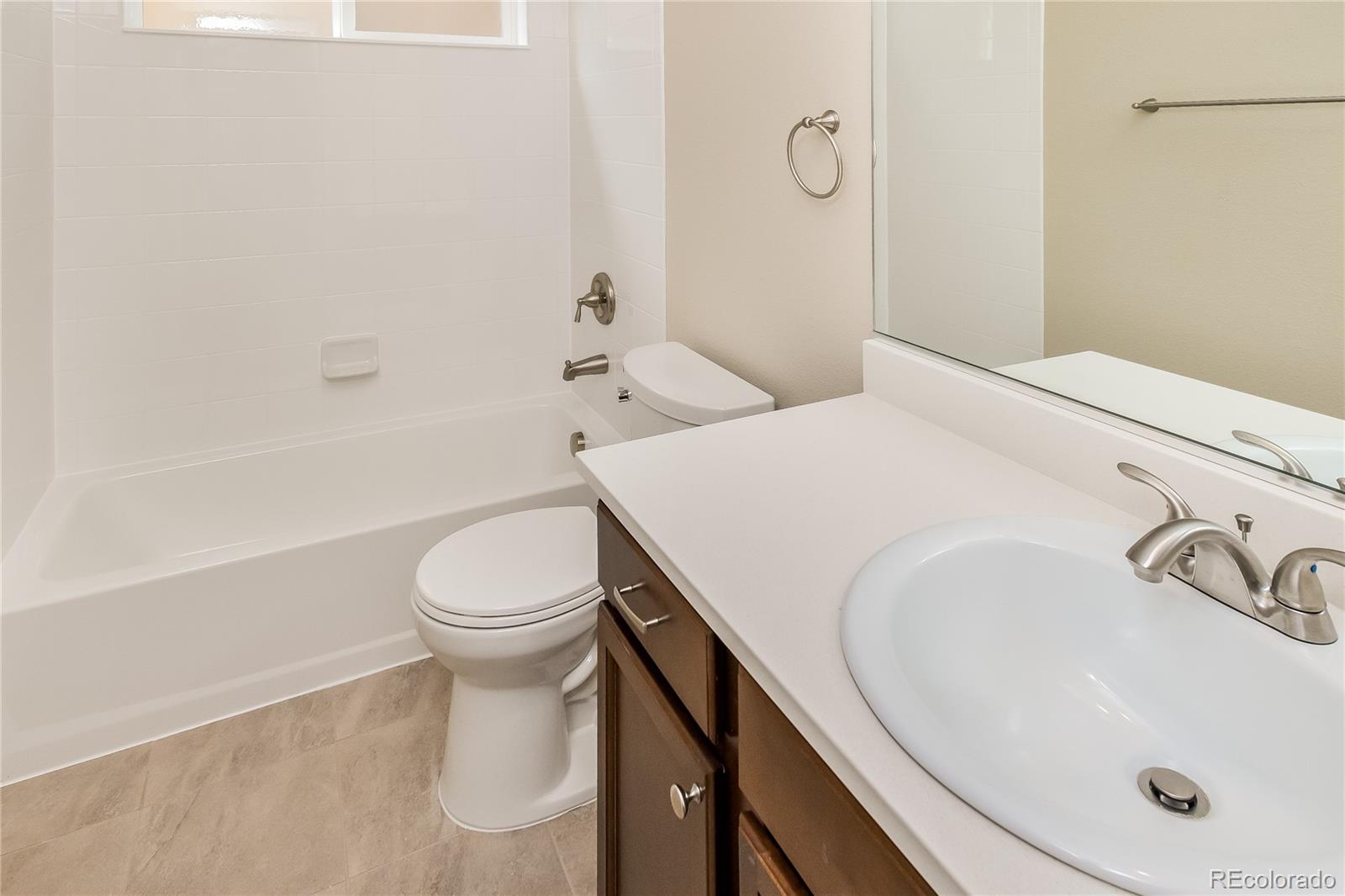 4441 Light View Colorado Springs, CO 80907 - Photo 14 of 17 a bathroom with a sink a toilet and shower