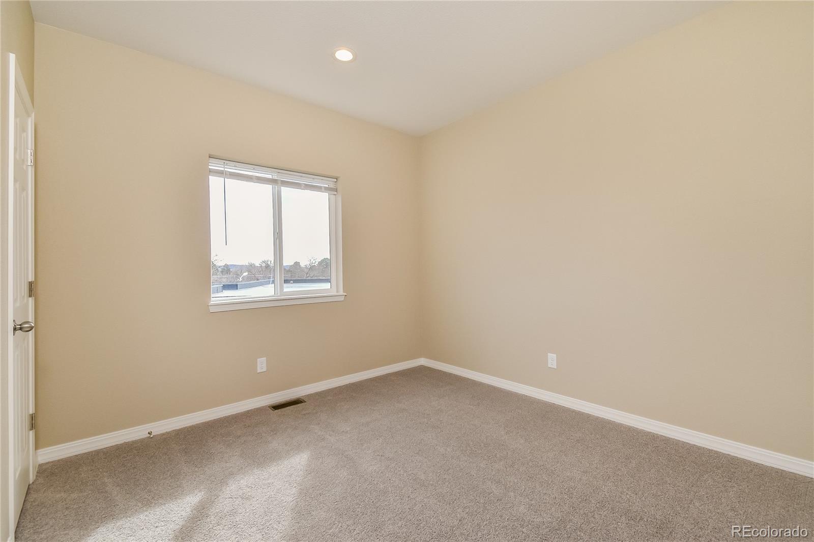4441 Light View Colorado Springs, CO 80907 - Photo 7 of 17 an empty room with a window