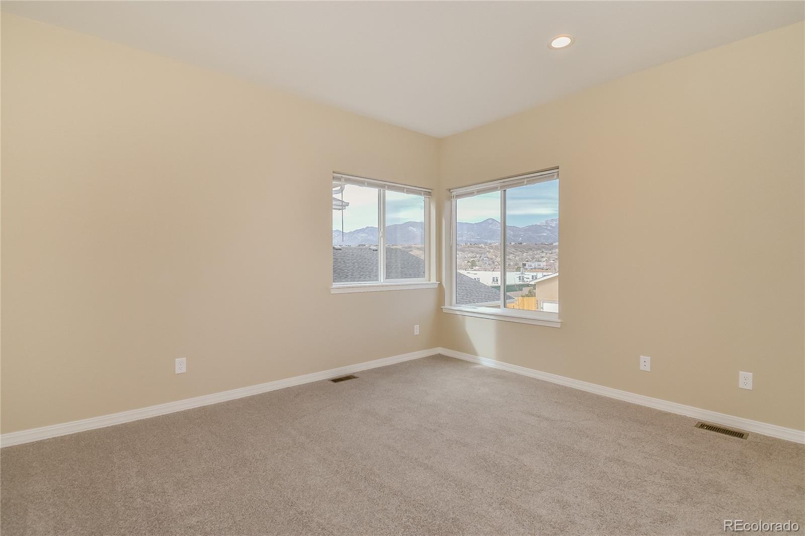 4441 Light View Colorado Springs, CO 80907 - Photo 8 of 17 an empty room with windows