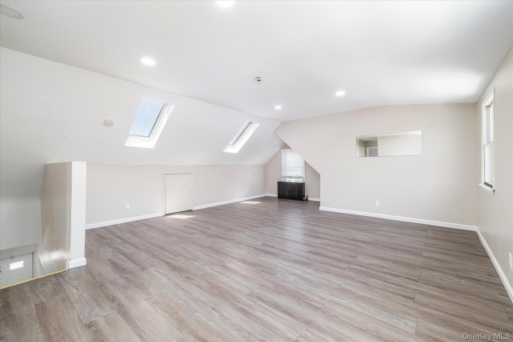 191 Raff Avenue Mineola, NY 11501 - Photo 22 of 25 a view of empty room with wooden floor