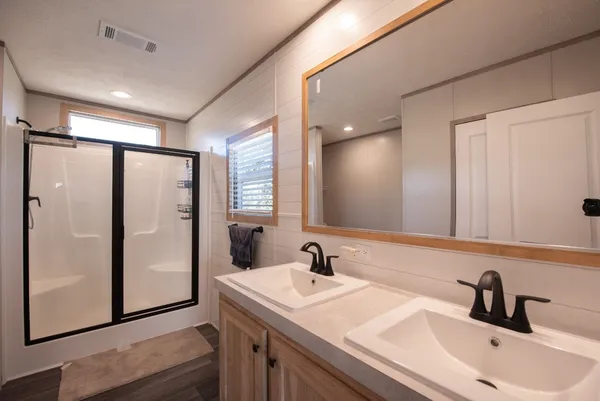 a bathroom with a sink and mirror