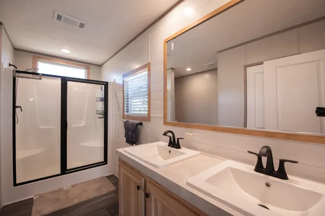 a bathroom with a sink and mirror