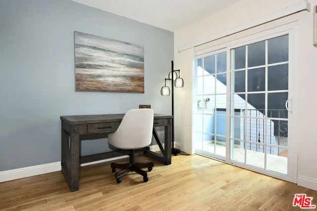 a view of workspace with wooden floor and chair