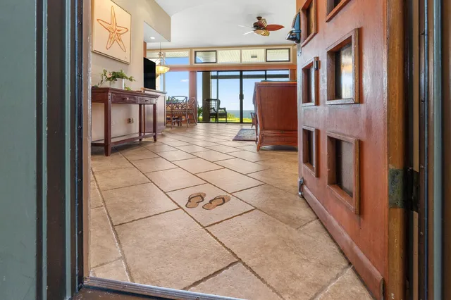a view of living room kitchen with furniture and large window