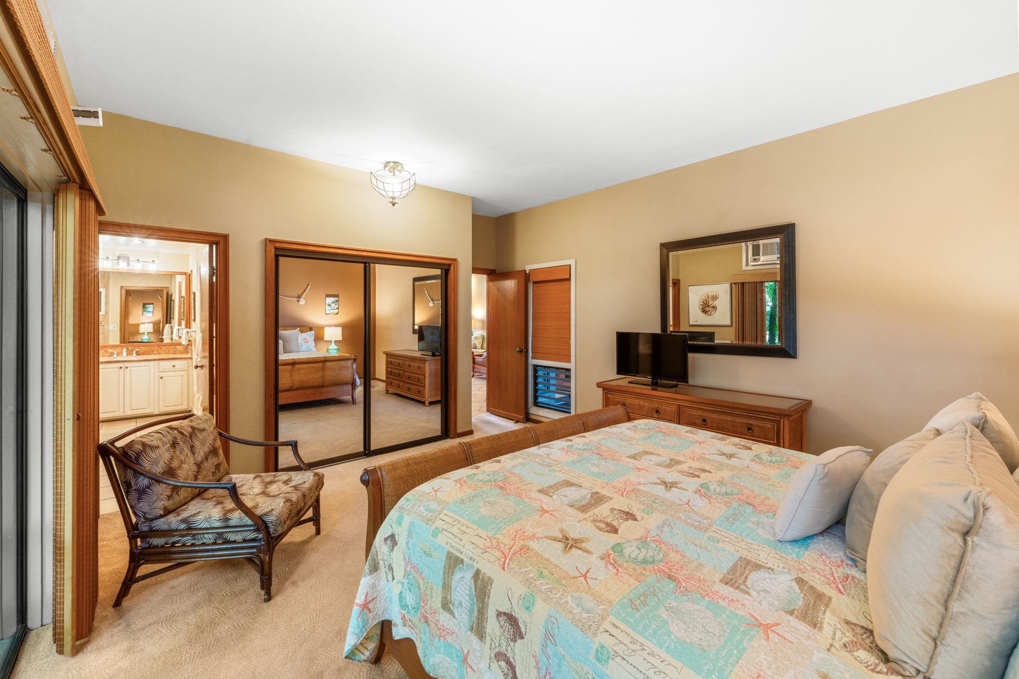 100 Ridge Road, Unit 1614 Lahaina, HI 96761 - Photo 15 of 50 a bedroom with a bed and large windows