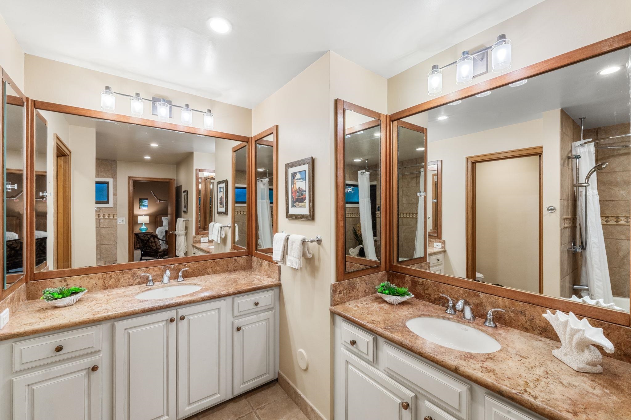 100 Ridge Road, Unit 1614 Lahaina, HI 96761 - Photo 19 of 50 a bathroom with a double vanity sink and a mirror