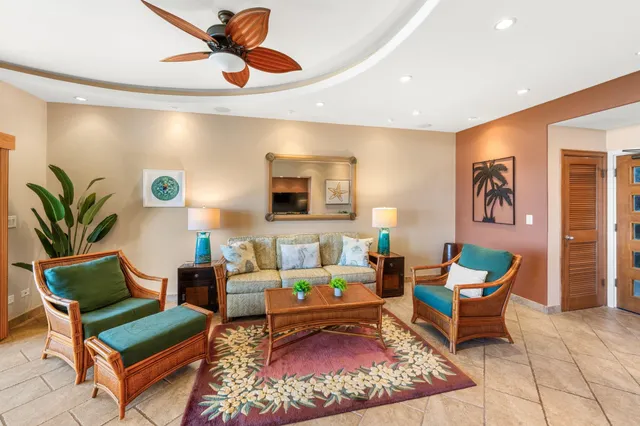 a living room with furniture rug and wooden floor