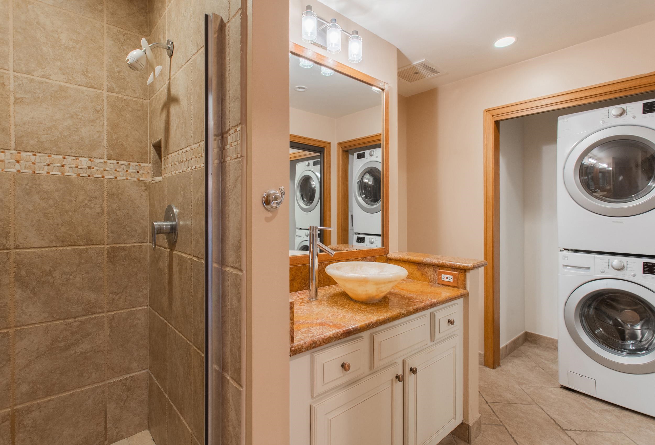 100 Ridge Road, Unit 1614 Lahaina, HI 96761 - Photo 23 of 50 a bathroom with a sink a washer and dryer