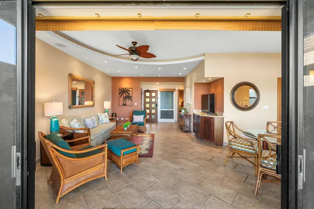 a room with furniture and a view of living room