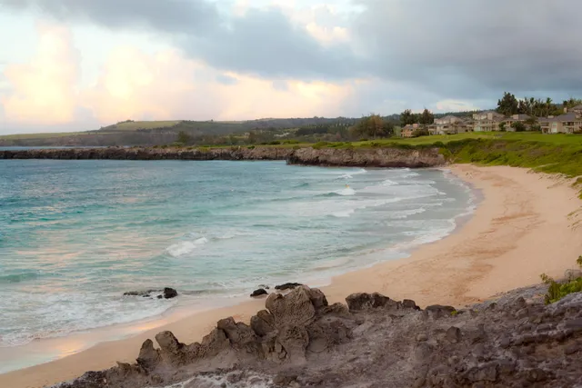 a view of a golf course with a lake