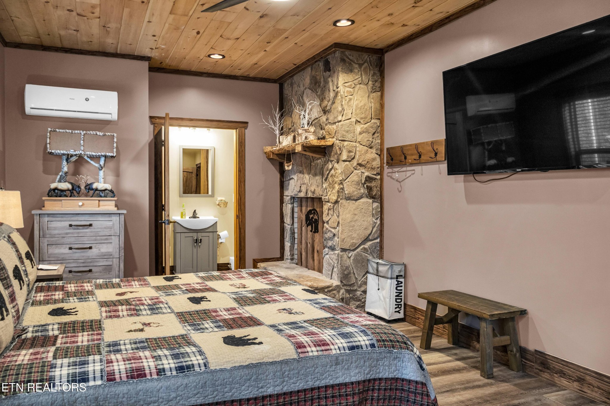 173 Rafter Road Tellico Plains, TN 37385 - Photo 26 of 49 a bedroom with a bed and a television