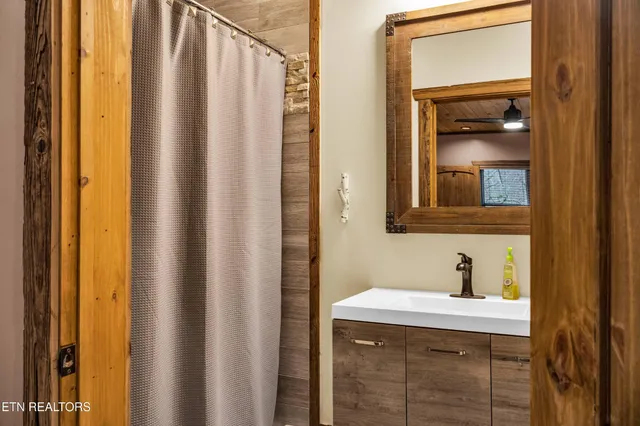 a living room with fireplace furniture and a flat screen tv