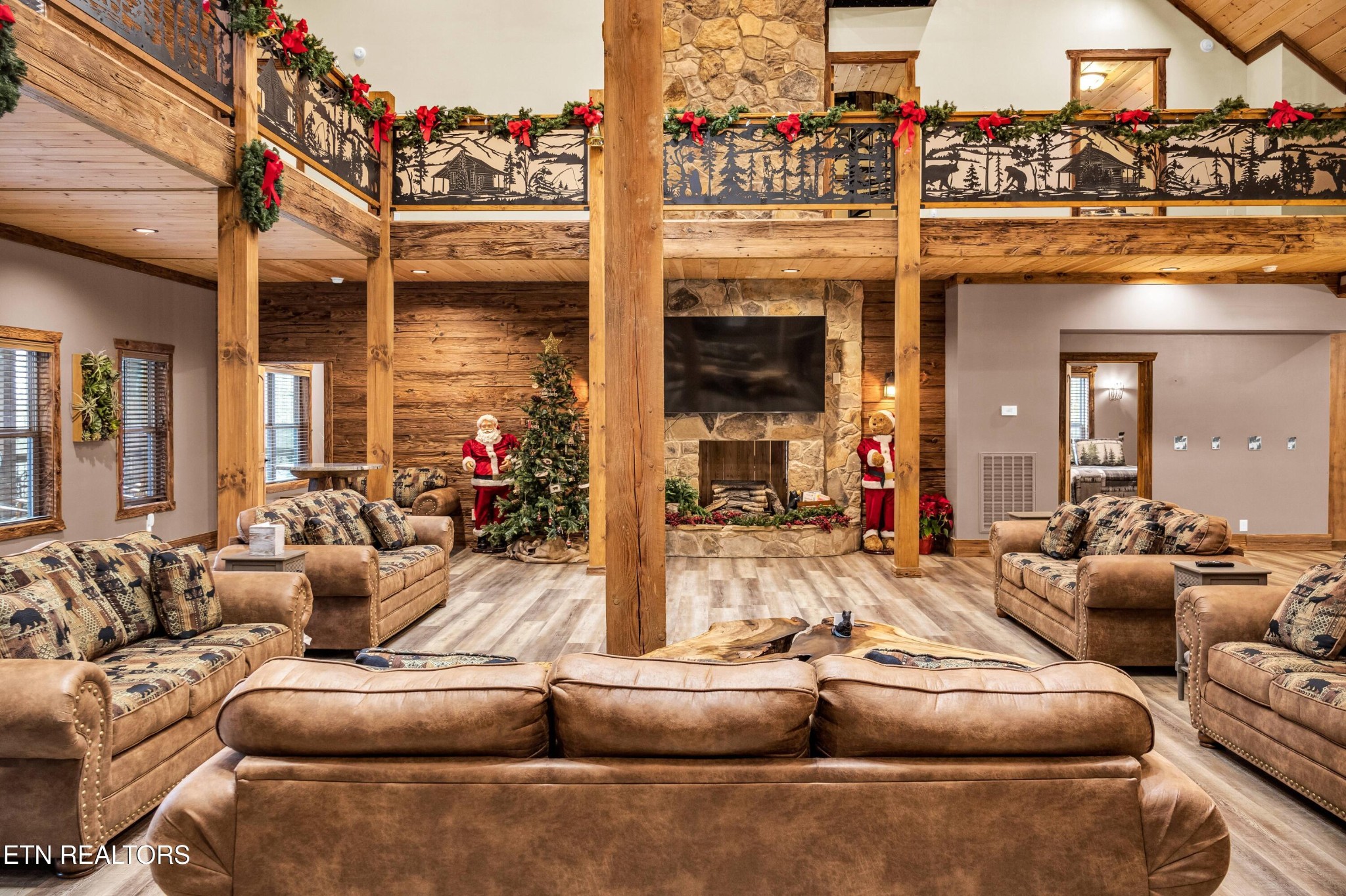173 Rafter Road Tellico Plains, TN 37385 - Photo 32 of 49 a living room with fireplace furniture and a flat screen tv