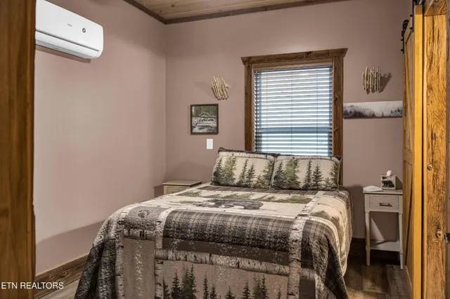 a bedroom with a bed and a window