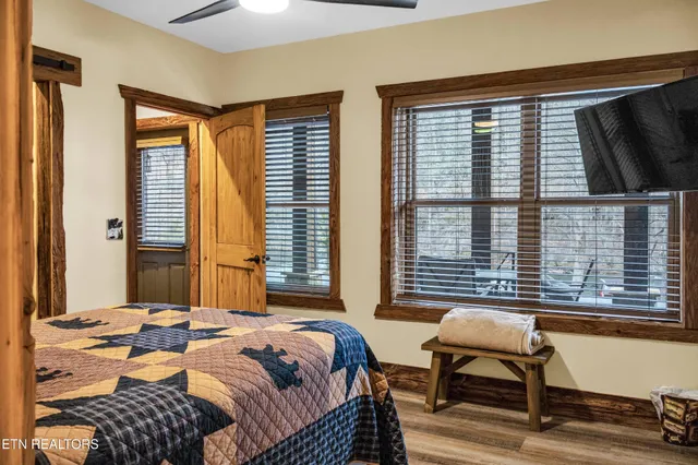 a bedroom with a bed and a mirror