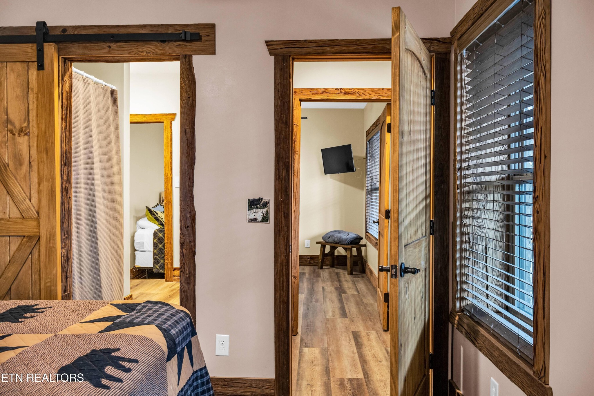 173 Rafter Road Tellico Plains, TN 37385 - Photo 42 of 49 a bedroom with a bed and a mirror