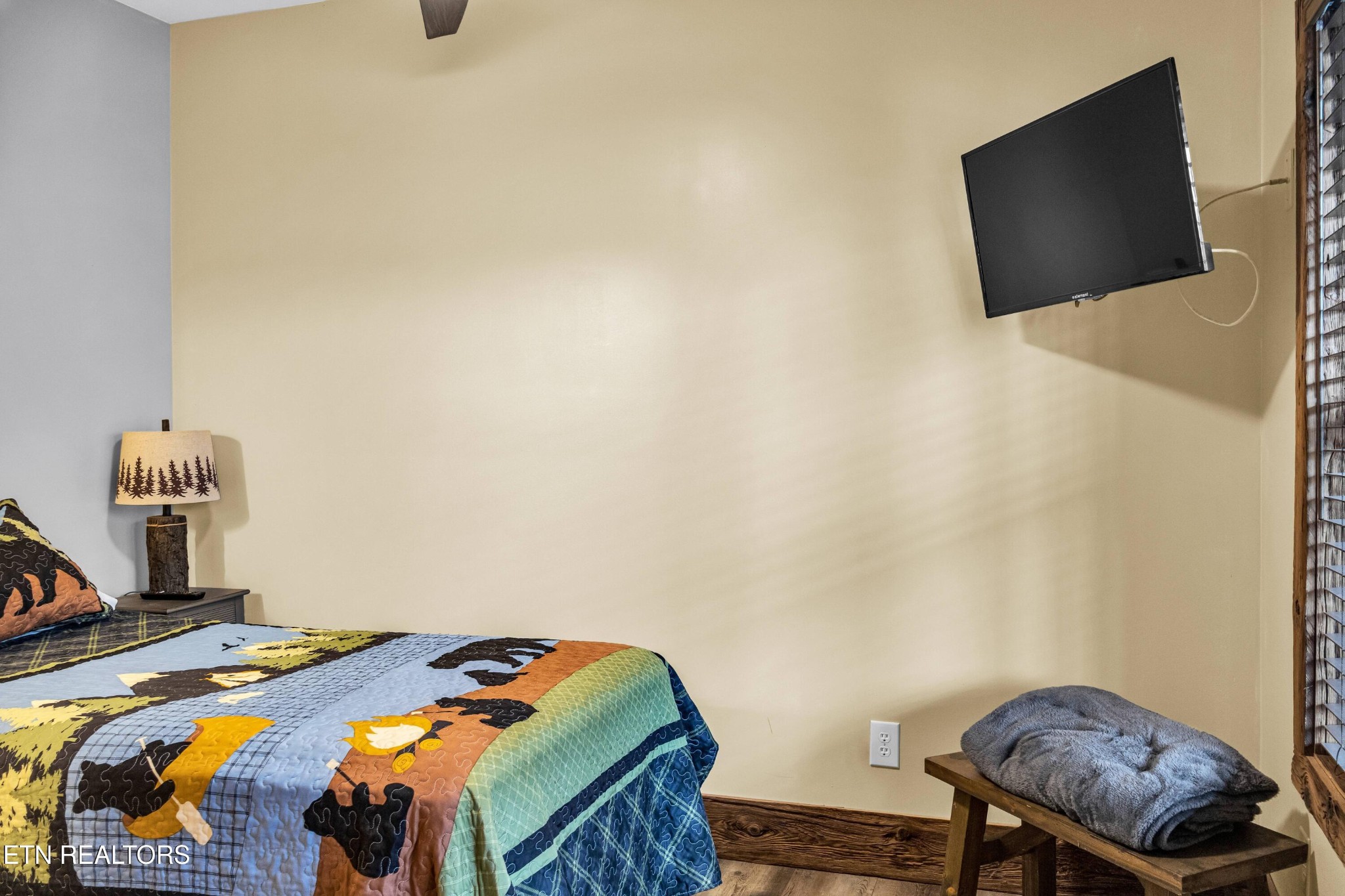 173 Rafter Road Tellico Plains, TN 37385 - Photo 43 of 49 a bedroom with a bed and flat screen tv