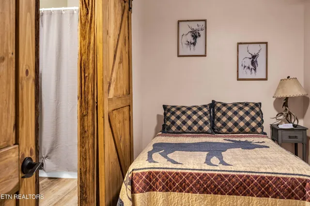 a bedroom with a sink and a mirror