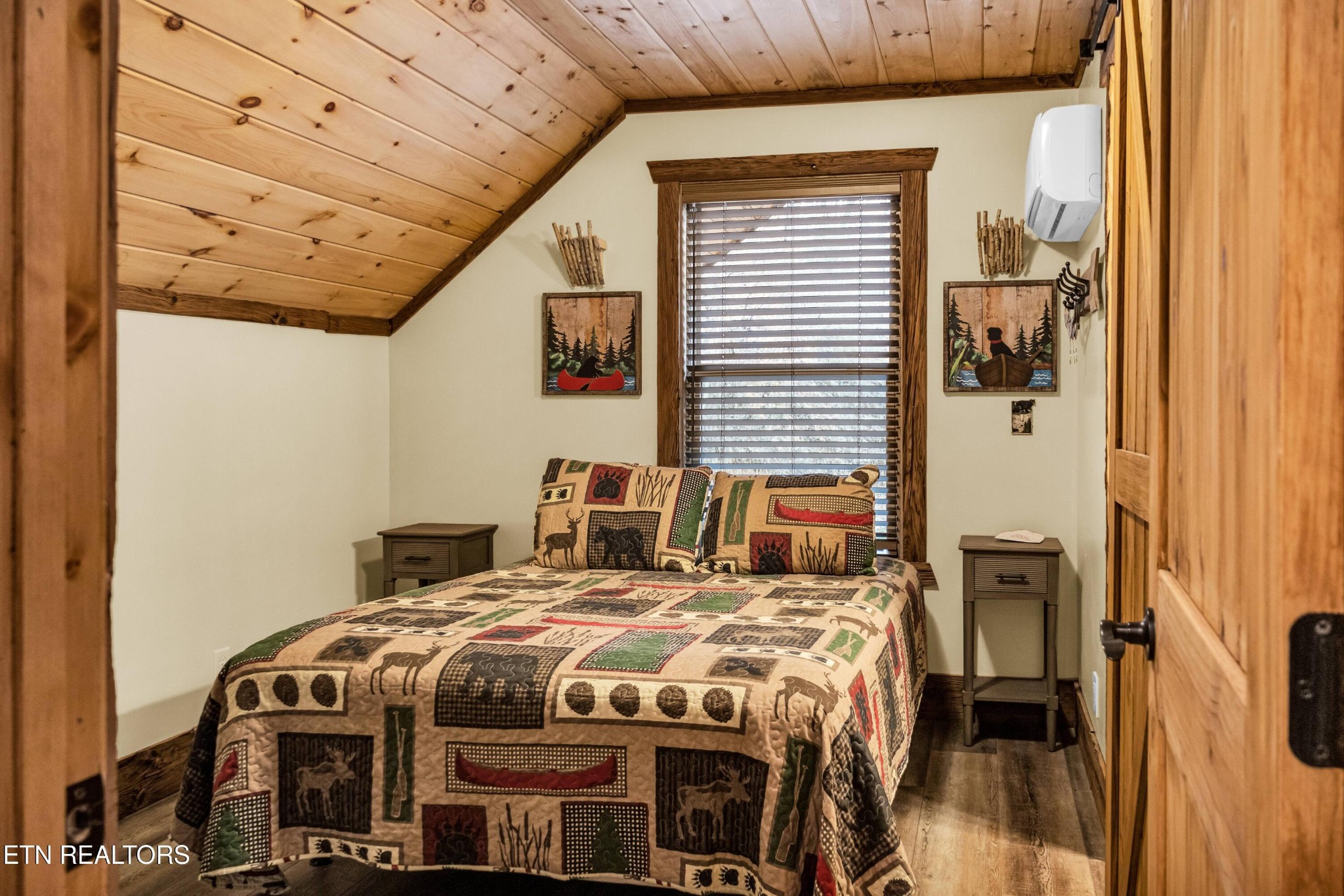 173 Rafter Road Tellico Plains, TN 37385 - Photo 47 of 49 a bedroom with a bed next to a window