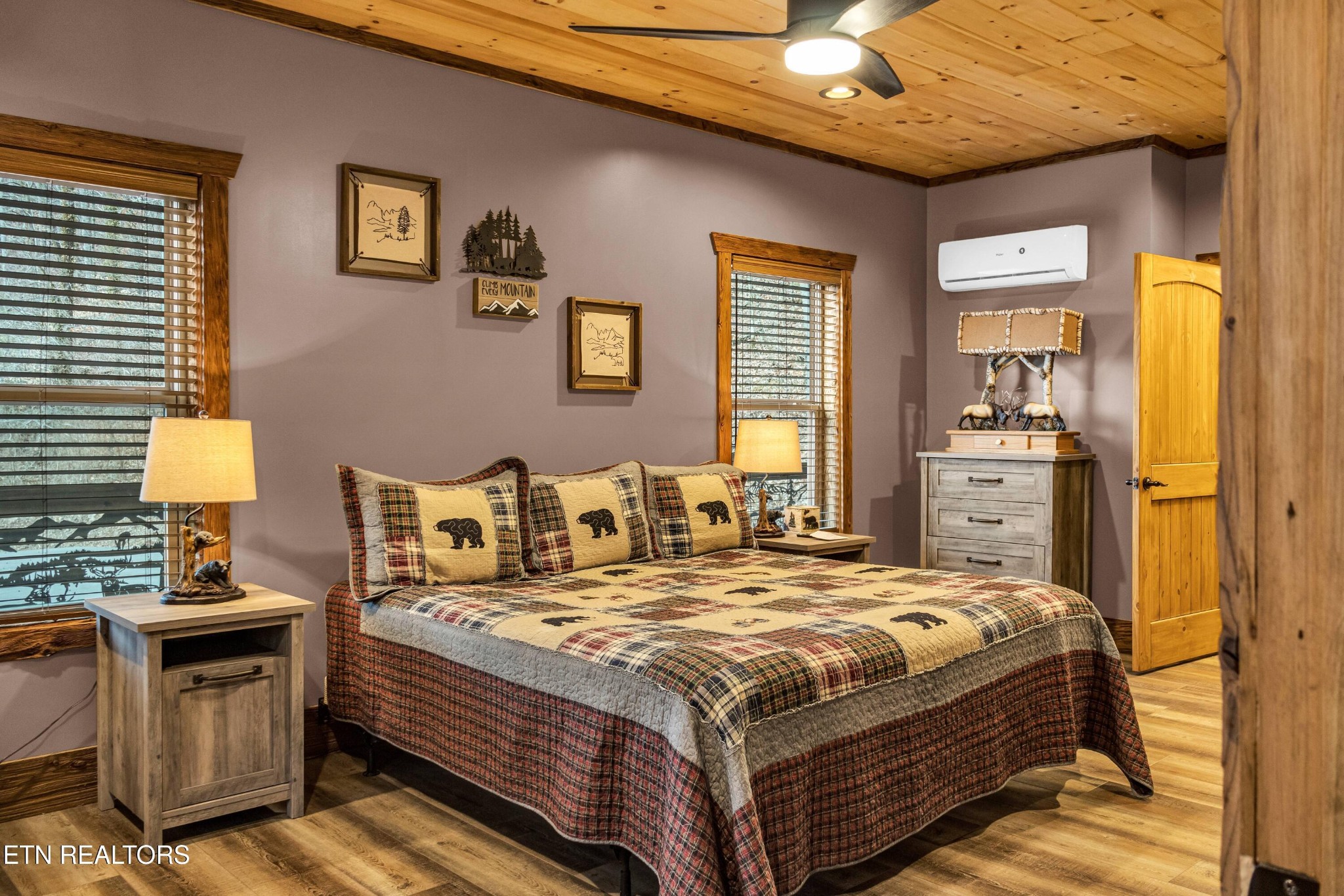 173 Rafter Road Tellico Plains, TN 37385 - Photo 5 of 49 a bedroom with a bed and wooden floor