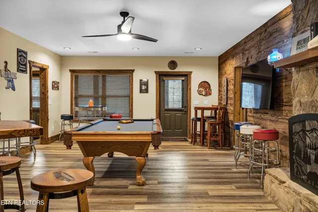 a living room with furniture and a fireplace