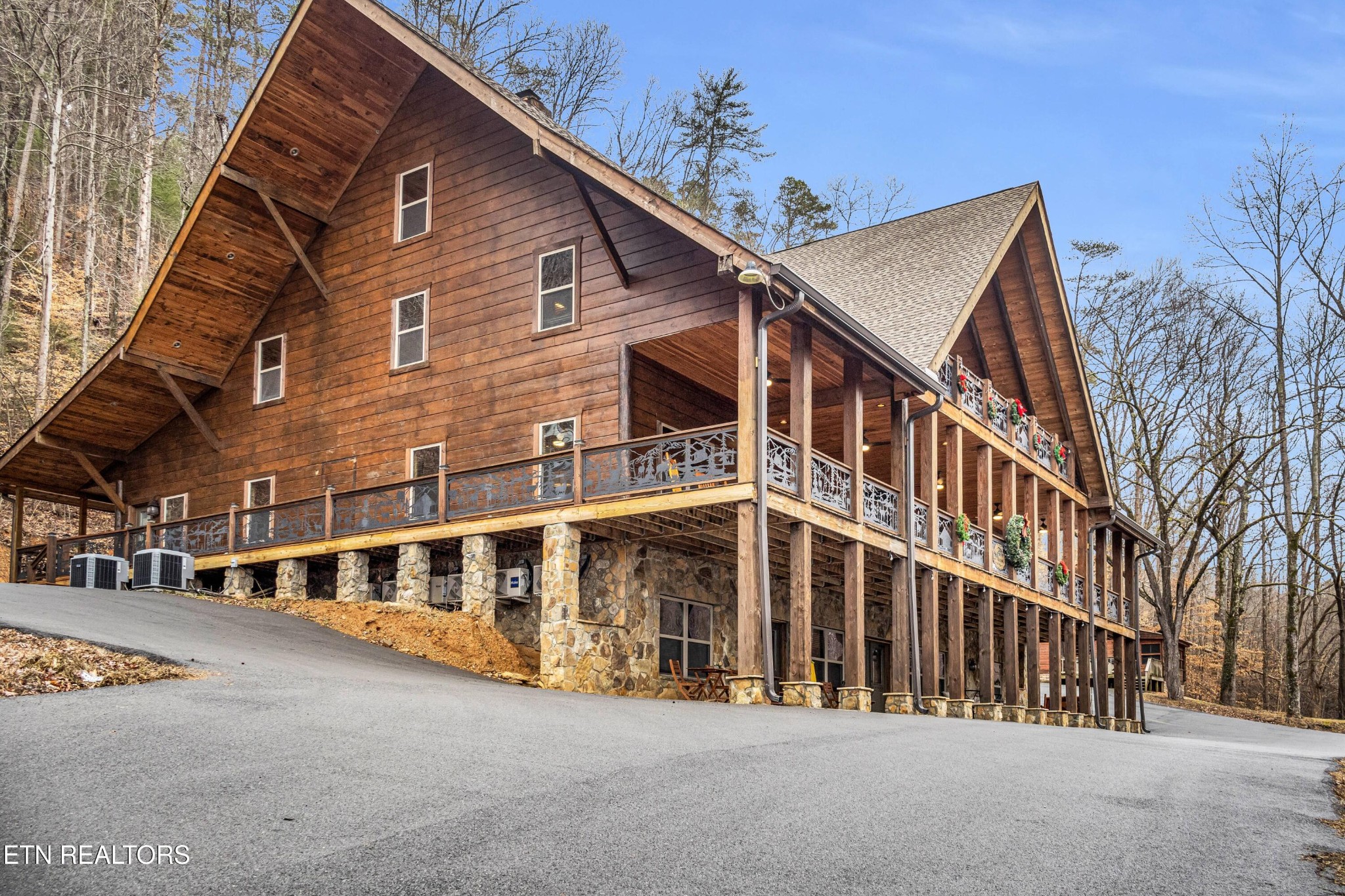 173 Rafter Road Tellico Plains, TN 37385 - Photo 10 of 49 a large building with a large windows