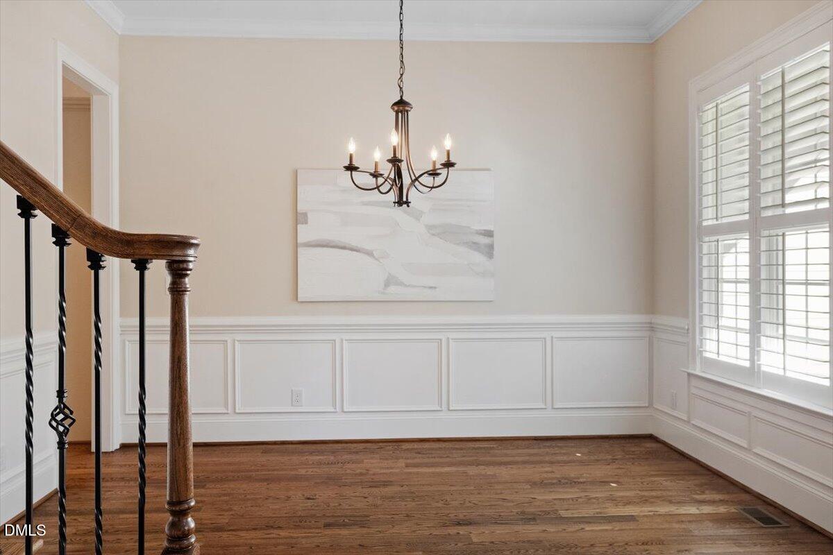 1321 Cedar Grove Road Pittsboro, NC 27312 - Photo 22 of 82 a view of a room with wooden floor and windows