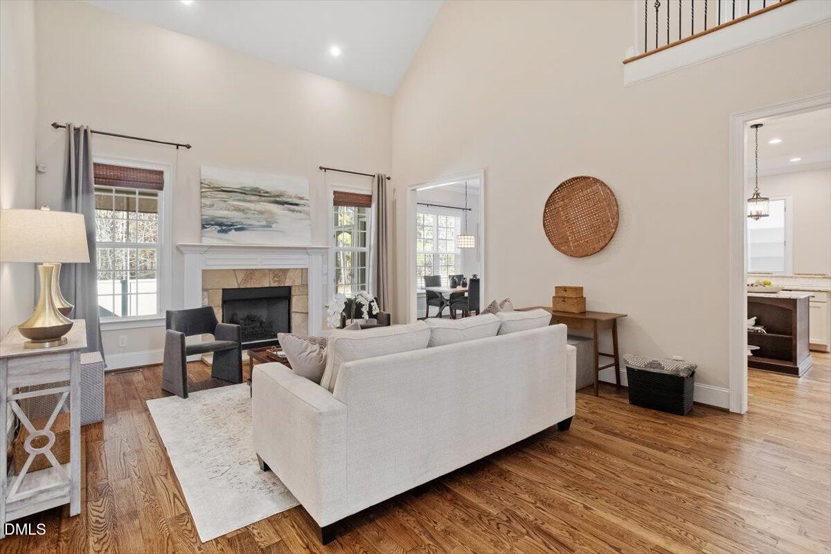 1321 Cedar Grove Road Pittsboro, NC 27312 - Photo 26 of 82 a living room with furniture a fireplace and a large window