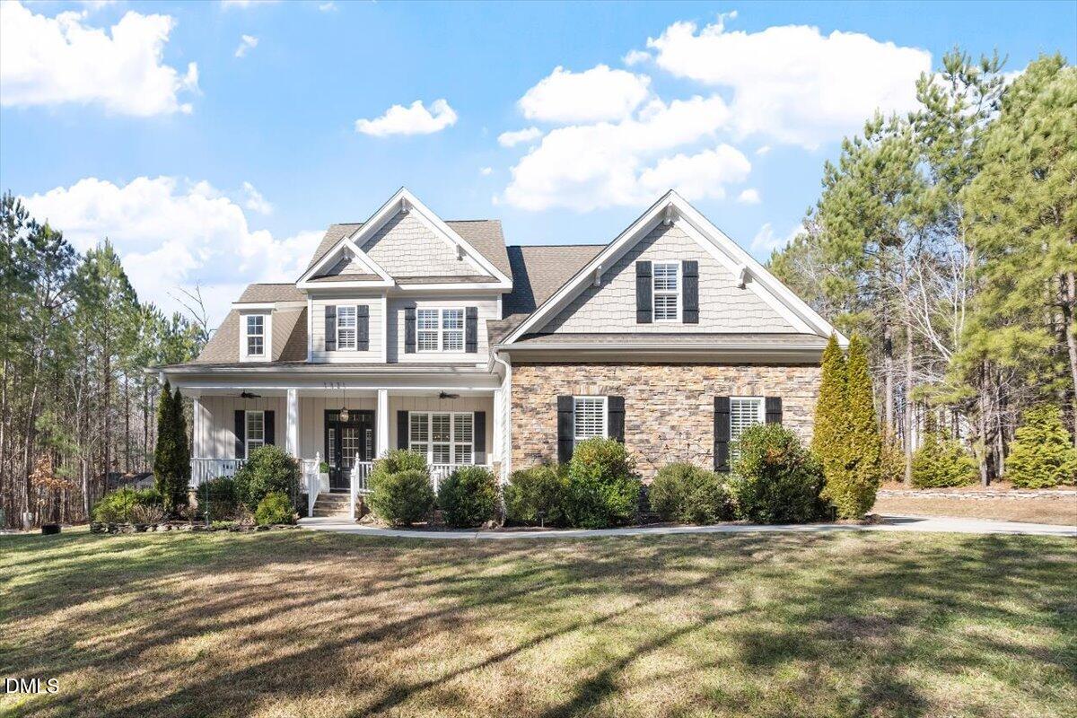 1321 Cedar Grove Road Pittsboro, NC 27312 - Photo 2 of 82 a front view of a house with a garden