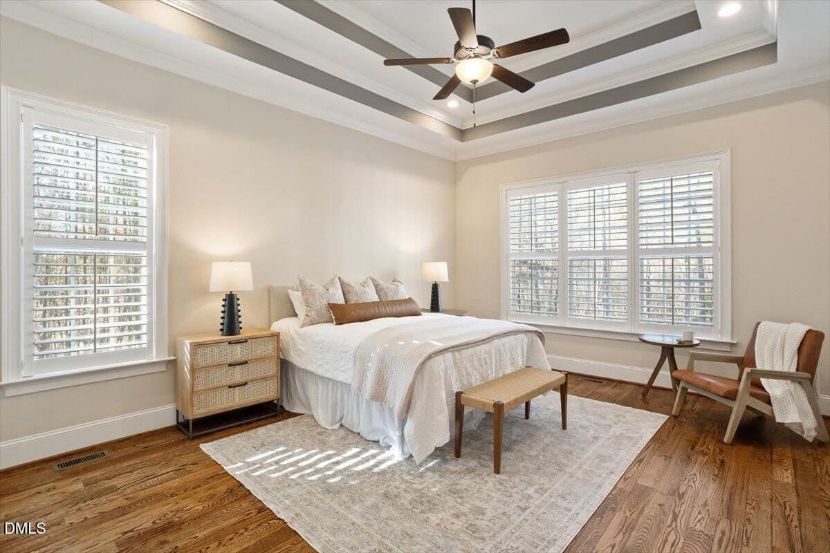 1321 Cedar Grove Road Pittsboro, NC 27312 - Photo 34 of 82 a spacious bedroom with a bed chairs and two windows