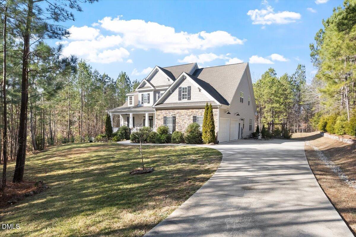 1321 Cedar Grove Road Pittsboro, NC 27312 - Photo 3 of 82 a front view of a house with a garden