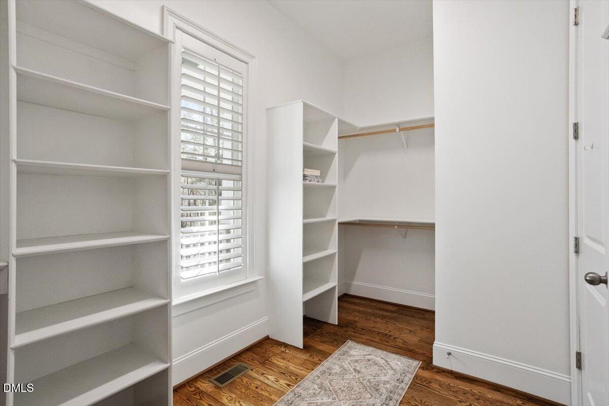 1321 Cedar Grove Road Pittsboro, NC 27312 - Photo 42 of 82 a view of walk in closet with empty racks