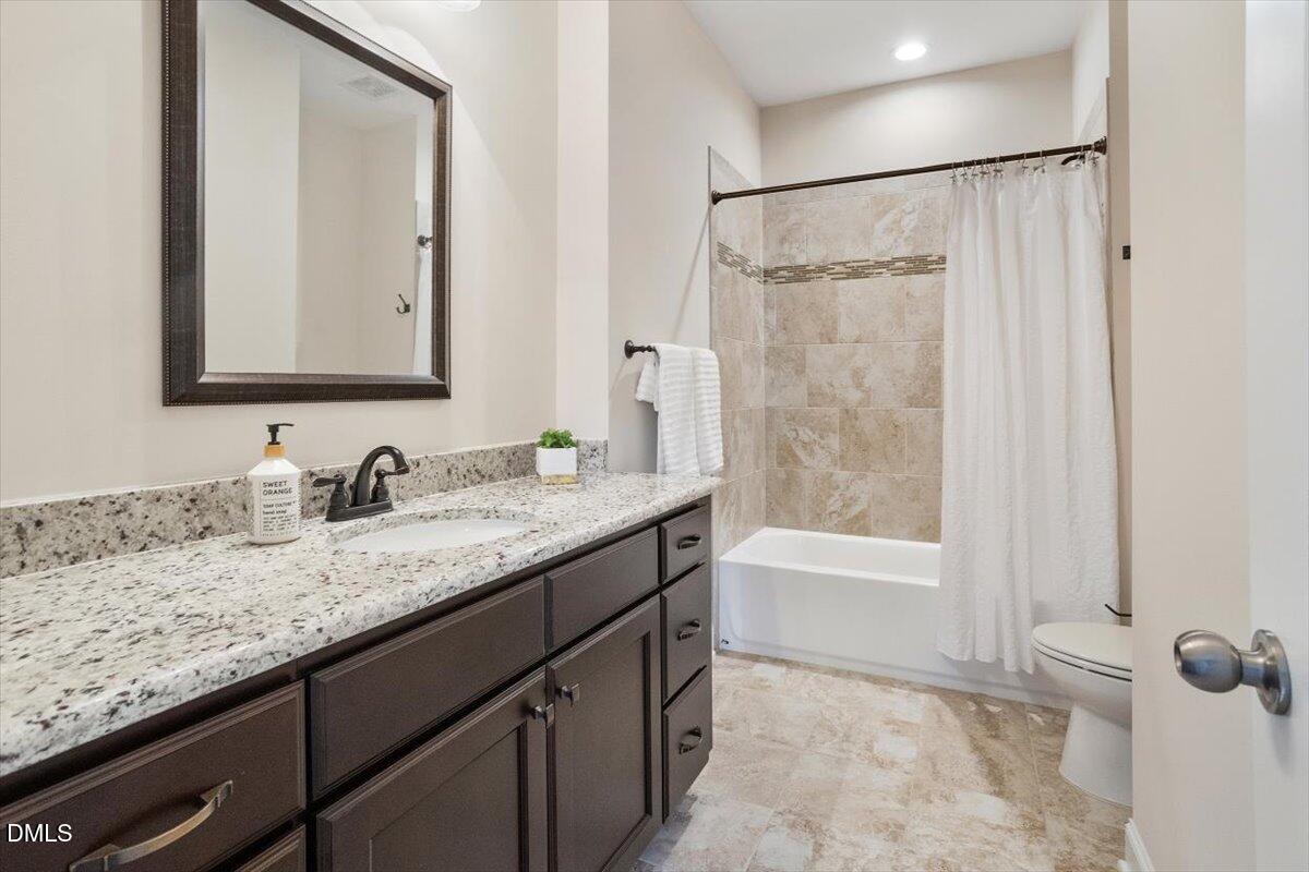 1321 Cedar Grove Road Pittsboro, NC 27312 - Photo 71 of 82 a bathroom with a granite countertop sink and a mirror