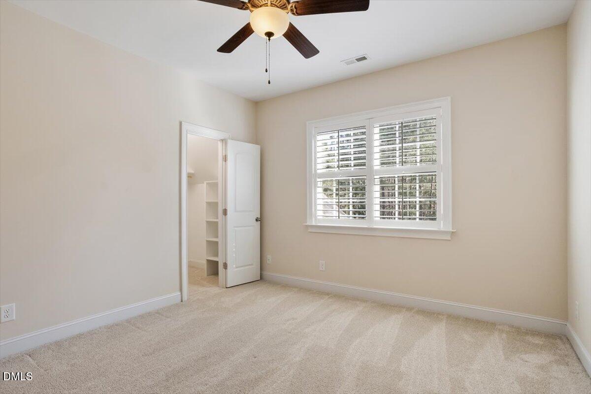 1321 Cedar Grove Road Pittsboro, NC 27312 - Photo 74 of 82 an empty room with windows and fan