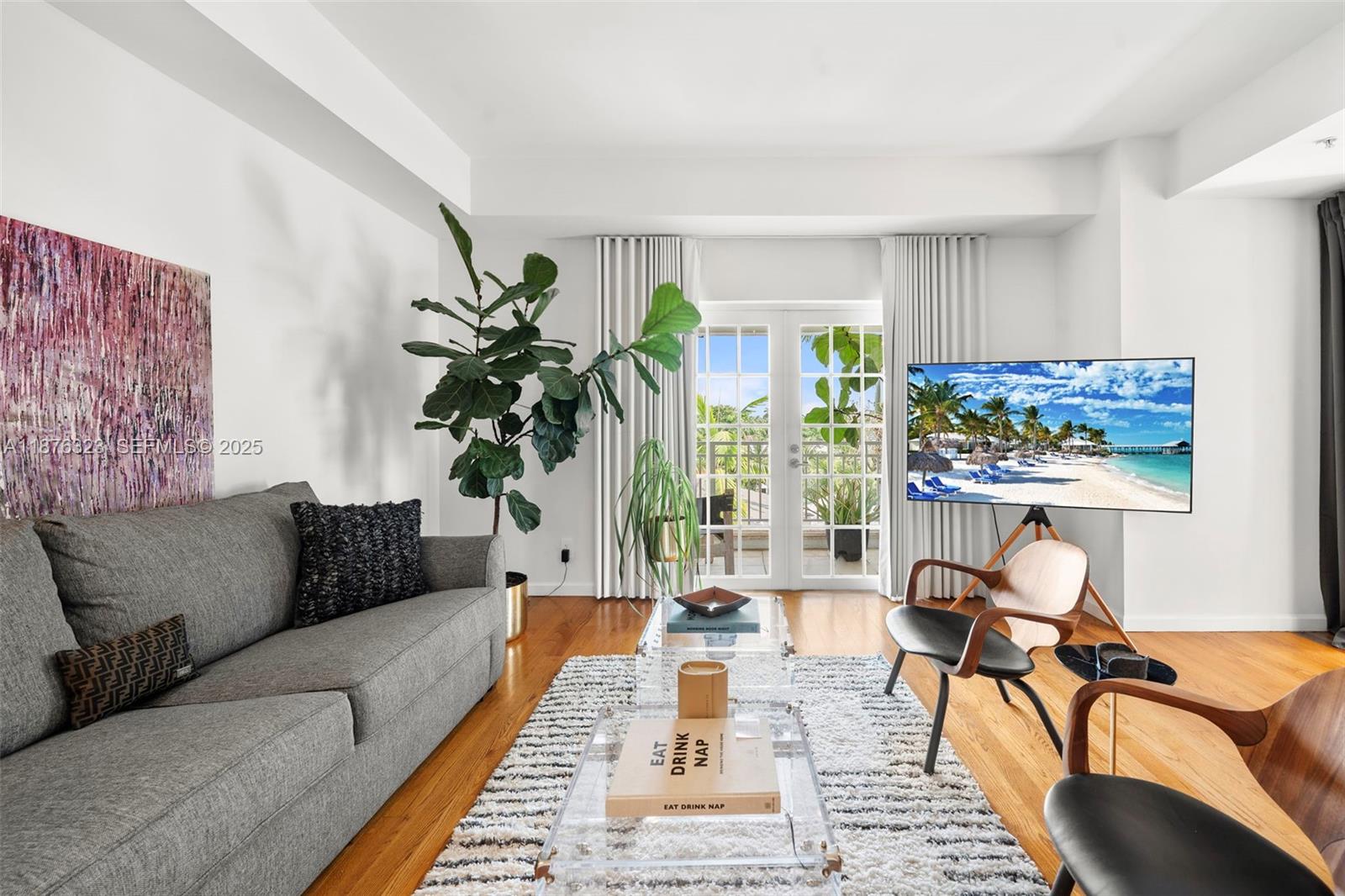 1415 Sunset Harbour Drive, Unit 406 Miami Beach, FL 33139 - Photo 19 of 83 a living room with furniture and a potted plant