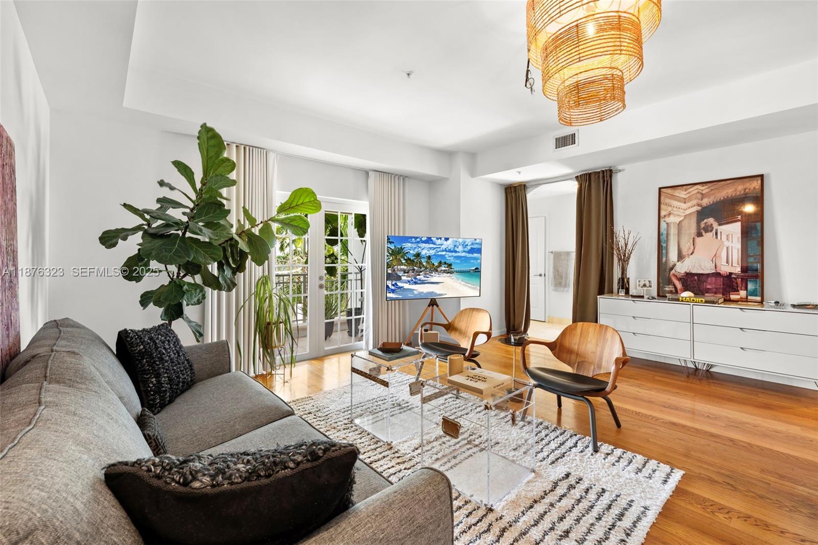 1415 Sunset Harbour Drive, Unit 406 Miami Beach, FL 33139 - Photo 20 of 83 a living room with furniture and a large window