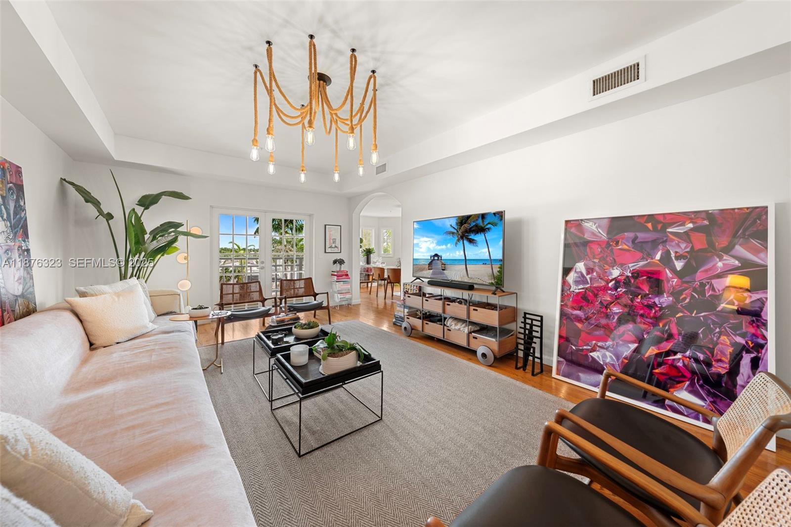 1415 Sunset Harbour Drive, Unit 406 Miami Beach, FL 33139 - Photo 2 of 83 a living room with furniture and a flat screen tv