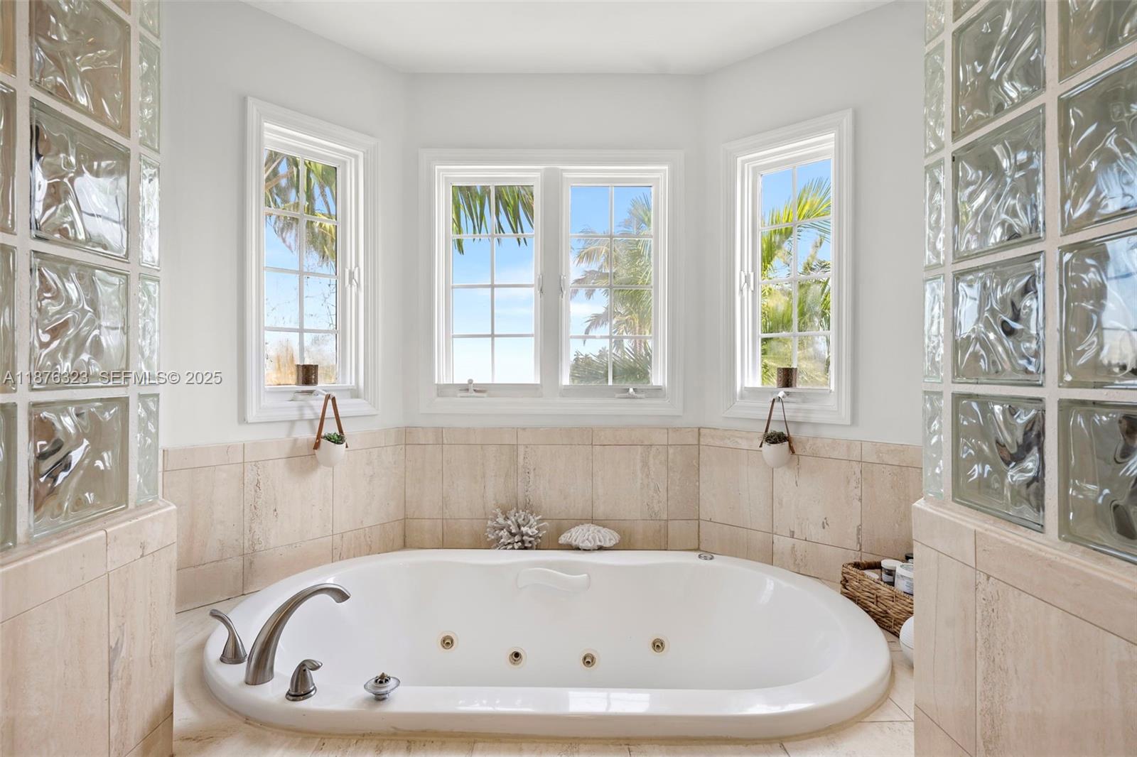 1415 Sunset Harbour Drive, Unit 406 Miami Beach, FL 33139 - Photo 21 of 83 a white bath tub sitting next to a window
