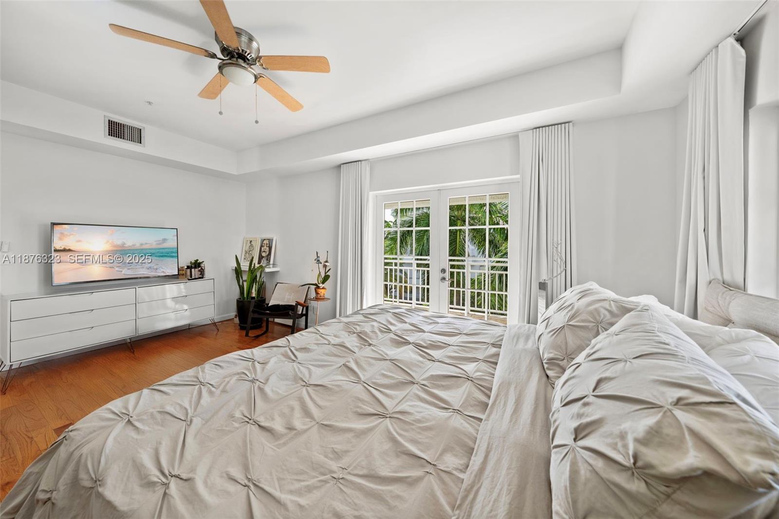 1415 Sunset Harbour Drive, Unit 406 Miami Beach, FL 33139 - Photo 29 of 83 a bed sitting in a spacious bedroom next to a window