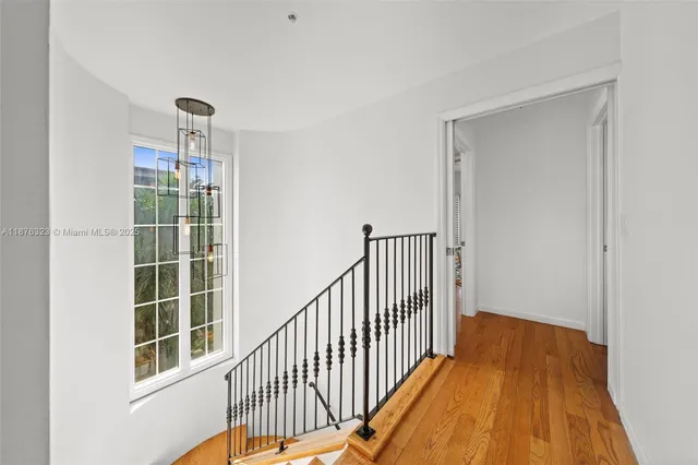 a view of a balcony with lake view and wooden floor