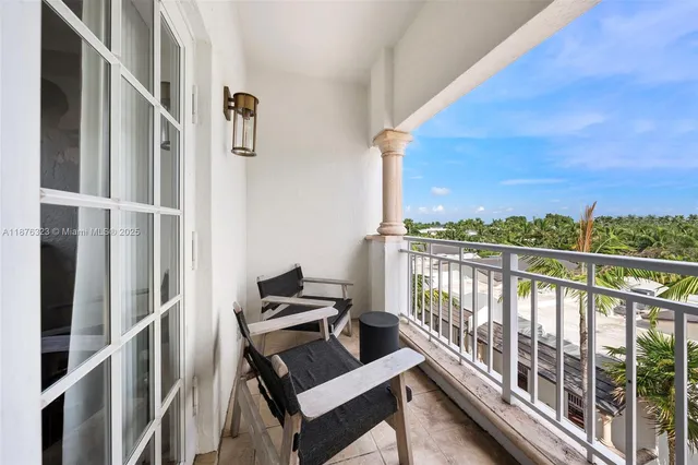 a view of a balcony with plants