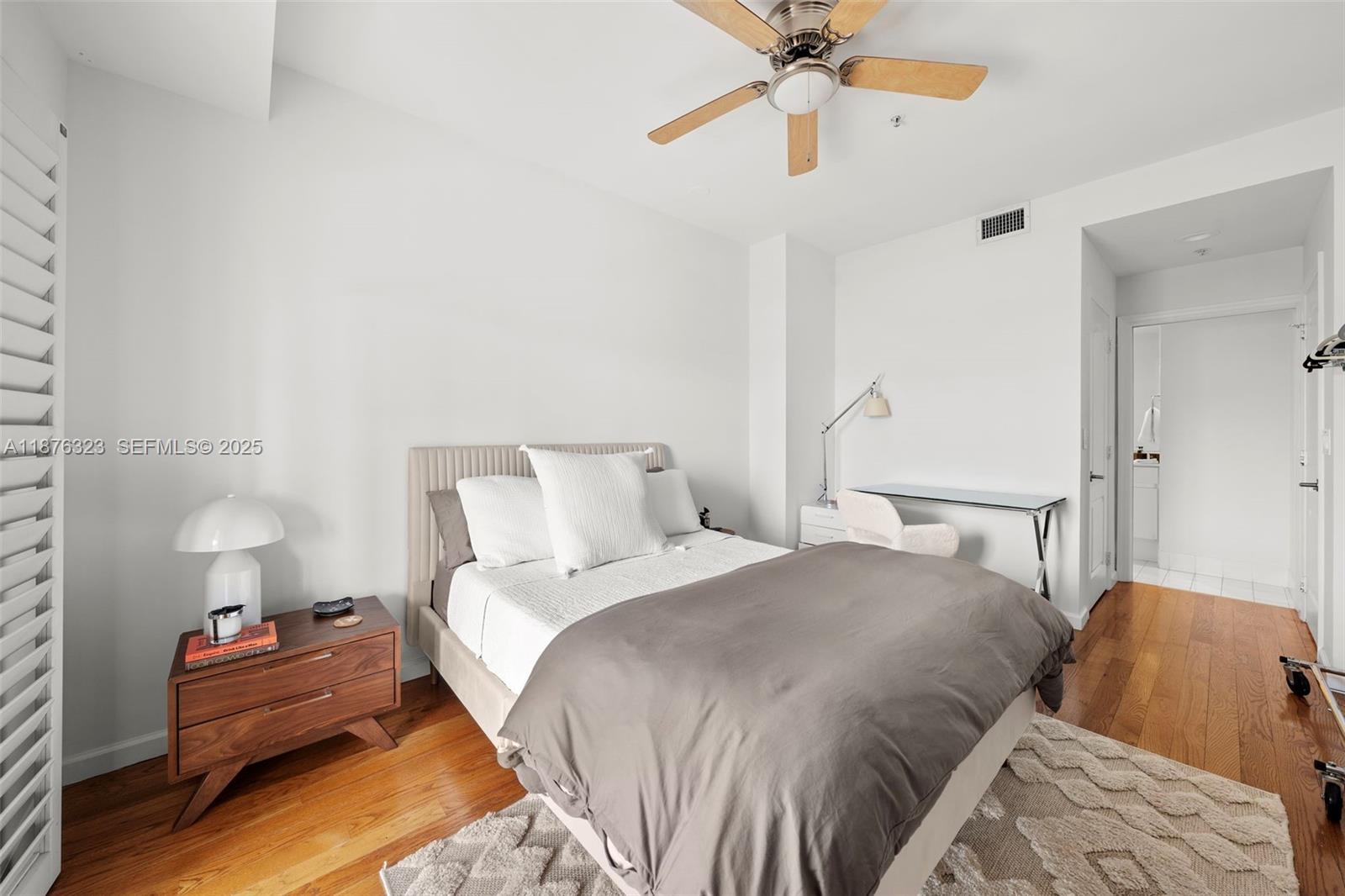 1415 Sunset Harbour Drive, Unit 406 Miami Beach, FL 33139 - Photo 49 of 83 a bedroom with a bed and ceiling fan