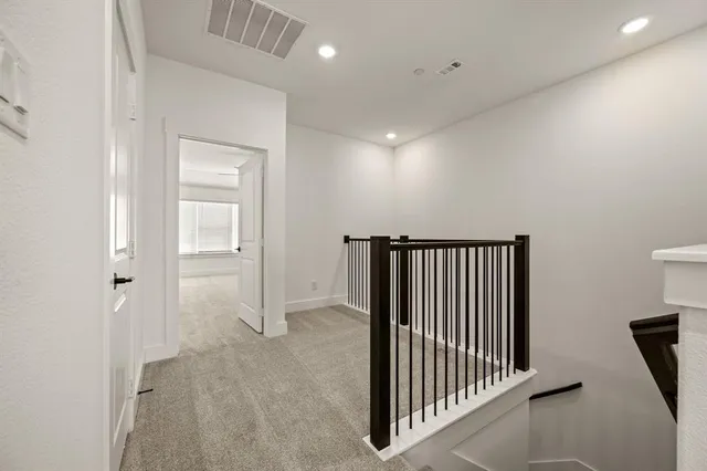 a large kitchen with stainless steel appliances granite countertop a stove and a sink