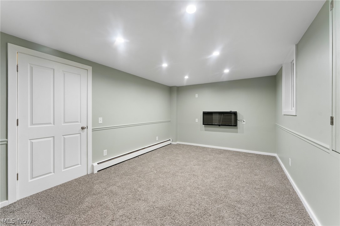 6881 Chestnut-Ridge Road Hubbard, OH 44425 - Photo 35 of 46 Basement with baseboard heating and carpet flooring