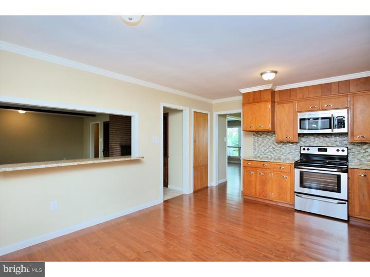 123 Sharp Road Avondale, PA 19311 - Photo 13 of 24 a view of kitchen with stainless steel appliances wooden floor and large window