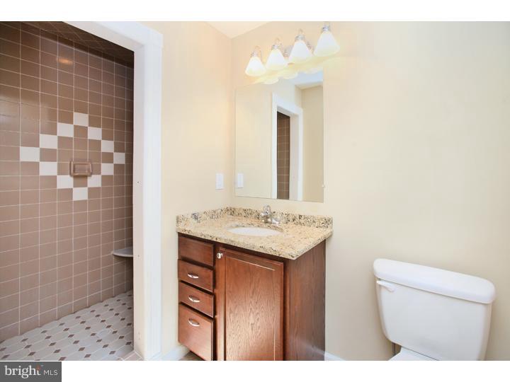 123 Sharp Road Avondale, PA 19311 - Photo 15 of 24 a bathroom with a sink a toilet and shower